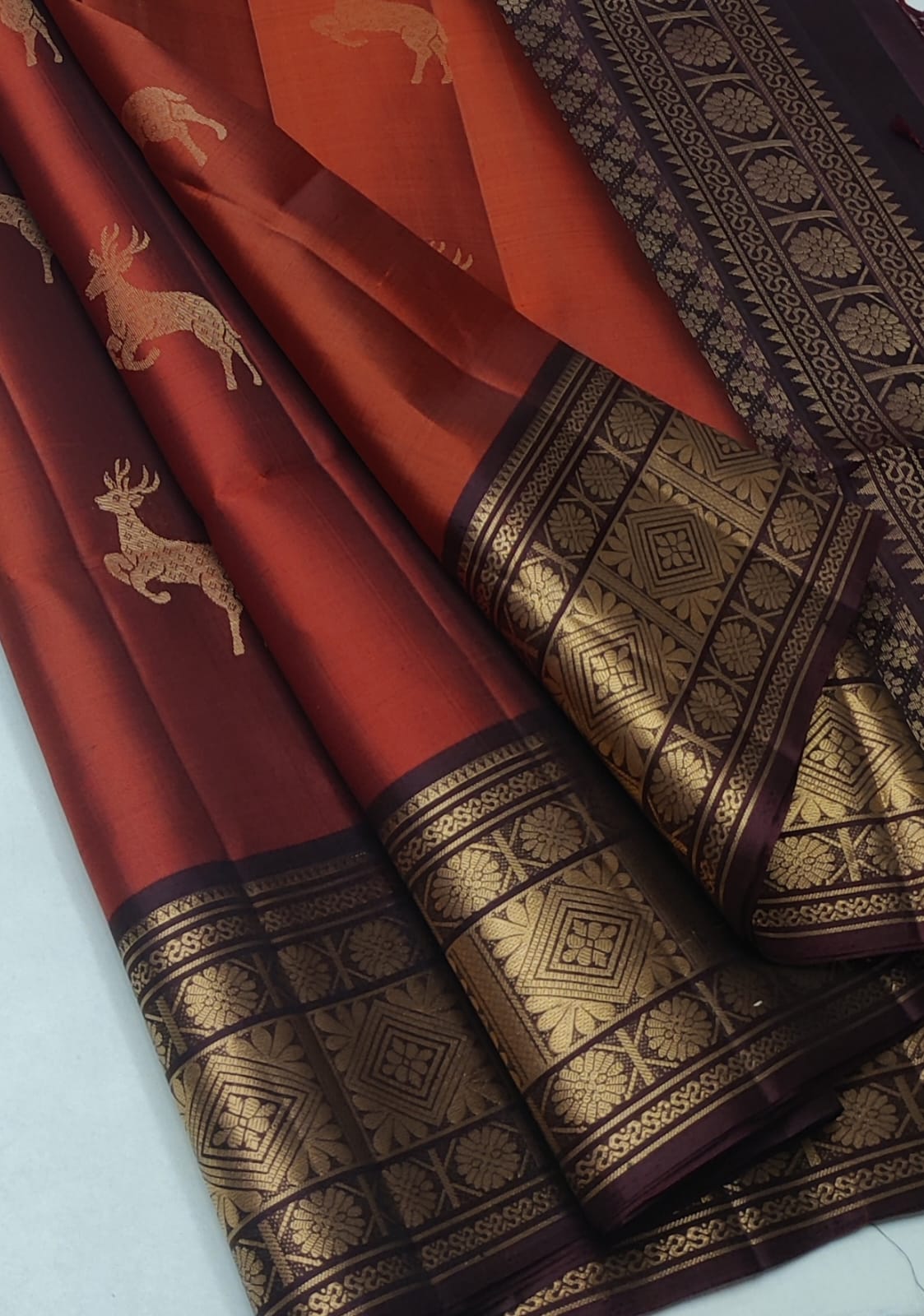 Kanchipuram Silk Saree featuring extensive gold zari Maroon